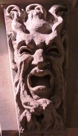 A stone face twisted in terror.