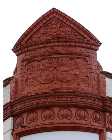 The old brick sign of the Frying Pan pub on Brick Lane.
