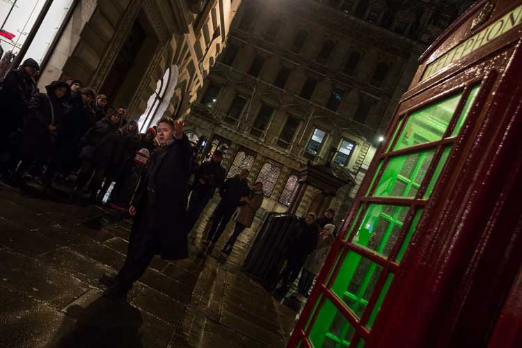 Richard Jones alongside a haunted phone box.