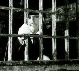 Richard looking through the cell bars at the House of Detention.