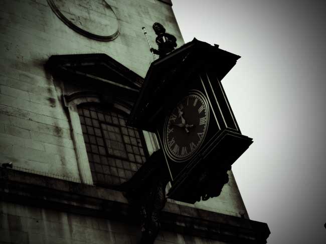 The tower and clock of the church of St James Garlick Hythe.